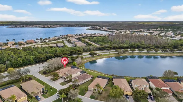 an aerial view of a house with a lake view