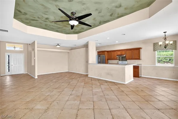 a view of a kitchen with a sink and a window