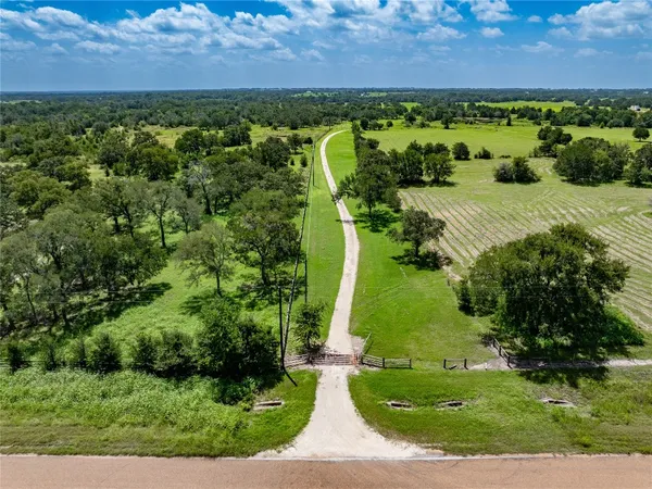 an aerial view of a golf course with houses