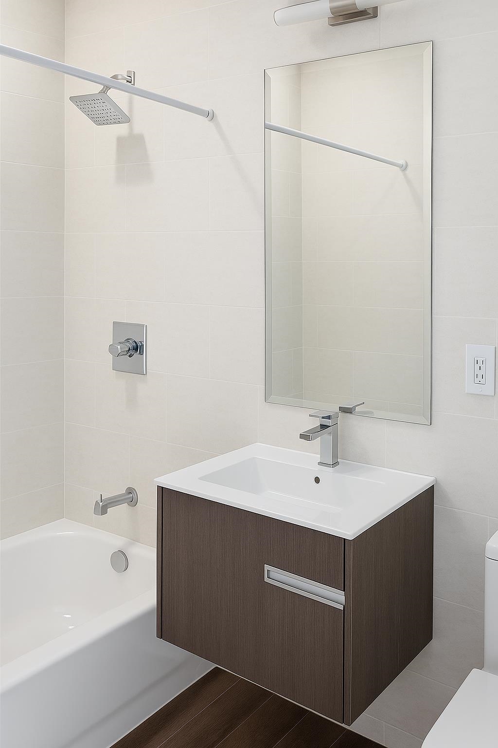 509 Washington Street, Unit 3 Hoboken, NJ 07030 - Photo 6 of 17 a bathroom with a sink a mirror and a bathtub