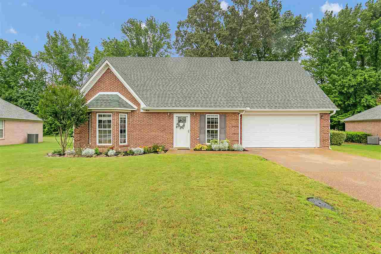 57 Union Fort Drive Jackson, TN 38305 - Photo 1 of 1 a front view of a house with a yard and garage