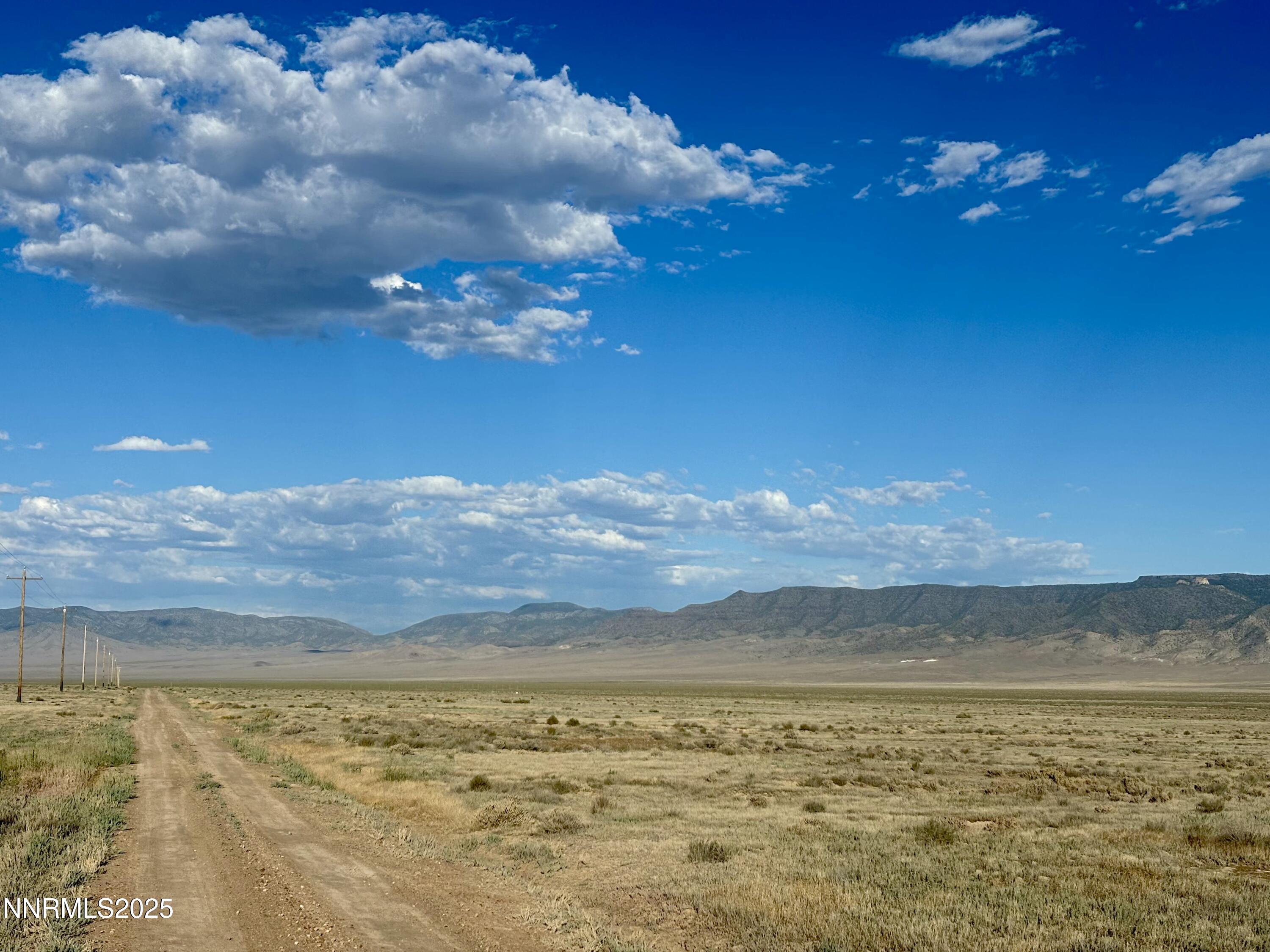 a view of a lake in the sunset