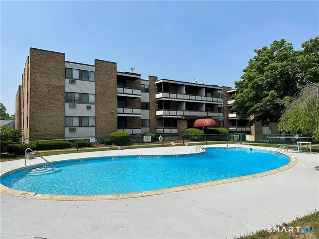 a view of pool with outdoor seating