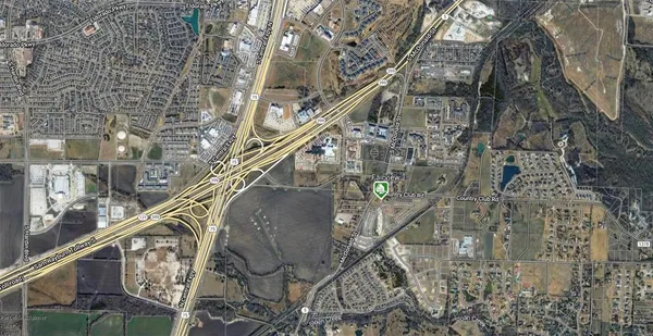 an aerial view of a house a yard and outdoor seating