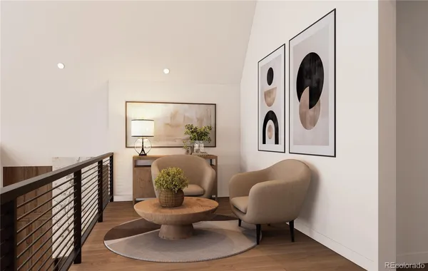 a living room with furniture and a painting