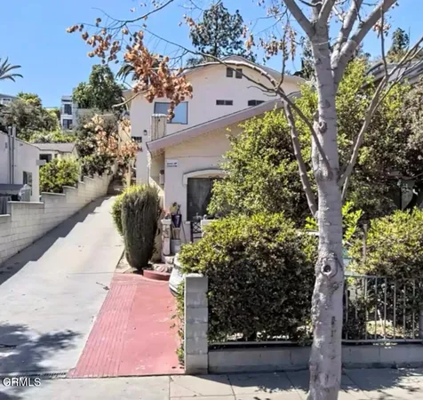 a view of a yard and front view of a house