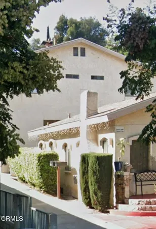 a front view of a building with outdoor space