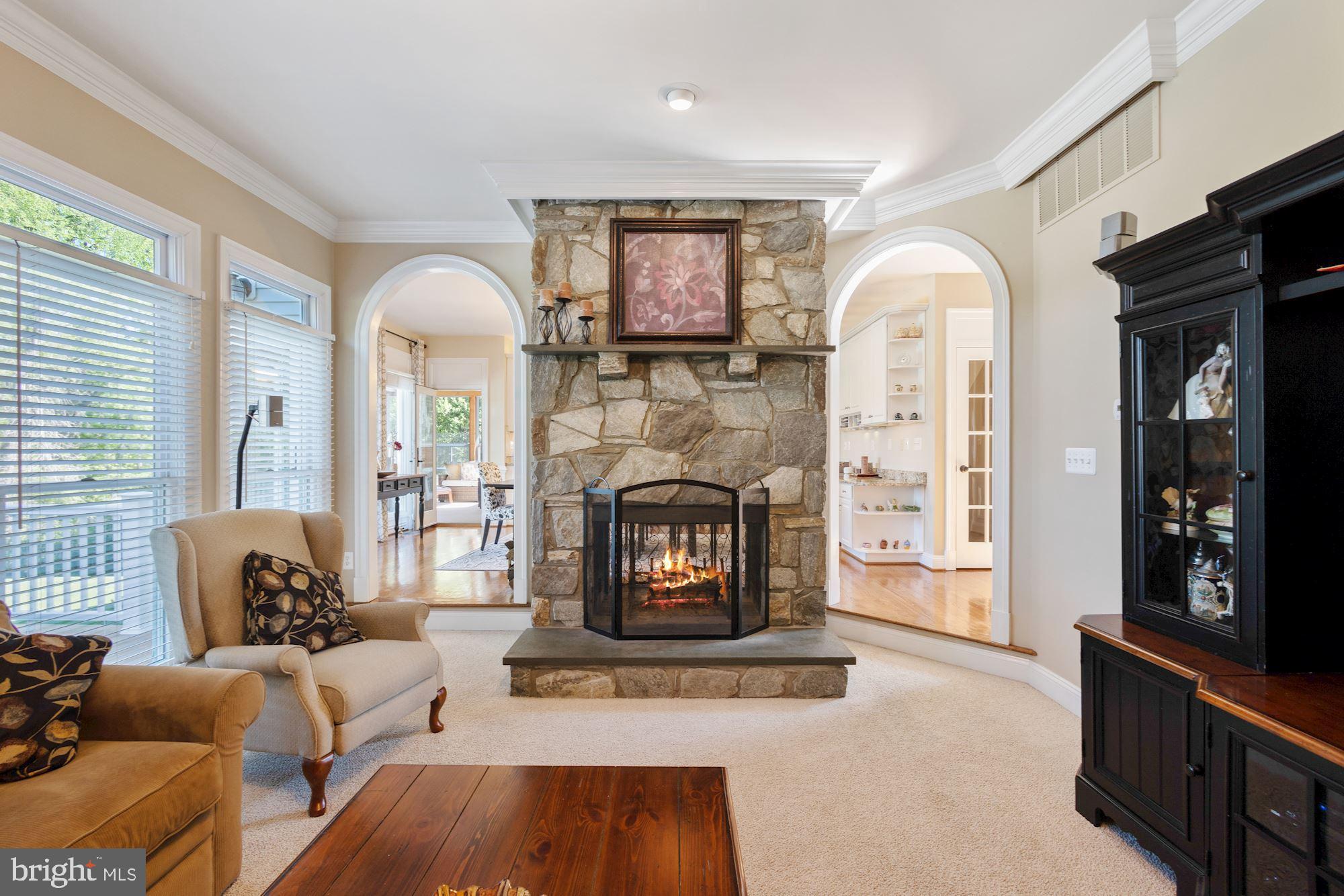 604 Glenmeade Circle Purcellville, VA 20132 - Photo 14 of 54 Double sided fireplace- stone on family room side