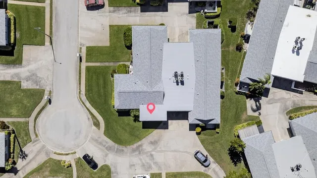 an aerial view of houses with outdoor space