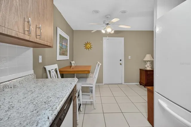 a view of a kitchen with granite countertop cabinets and outdoor space