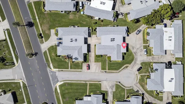 an aerial view of residential houses with outdoor space