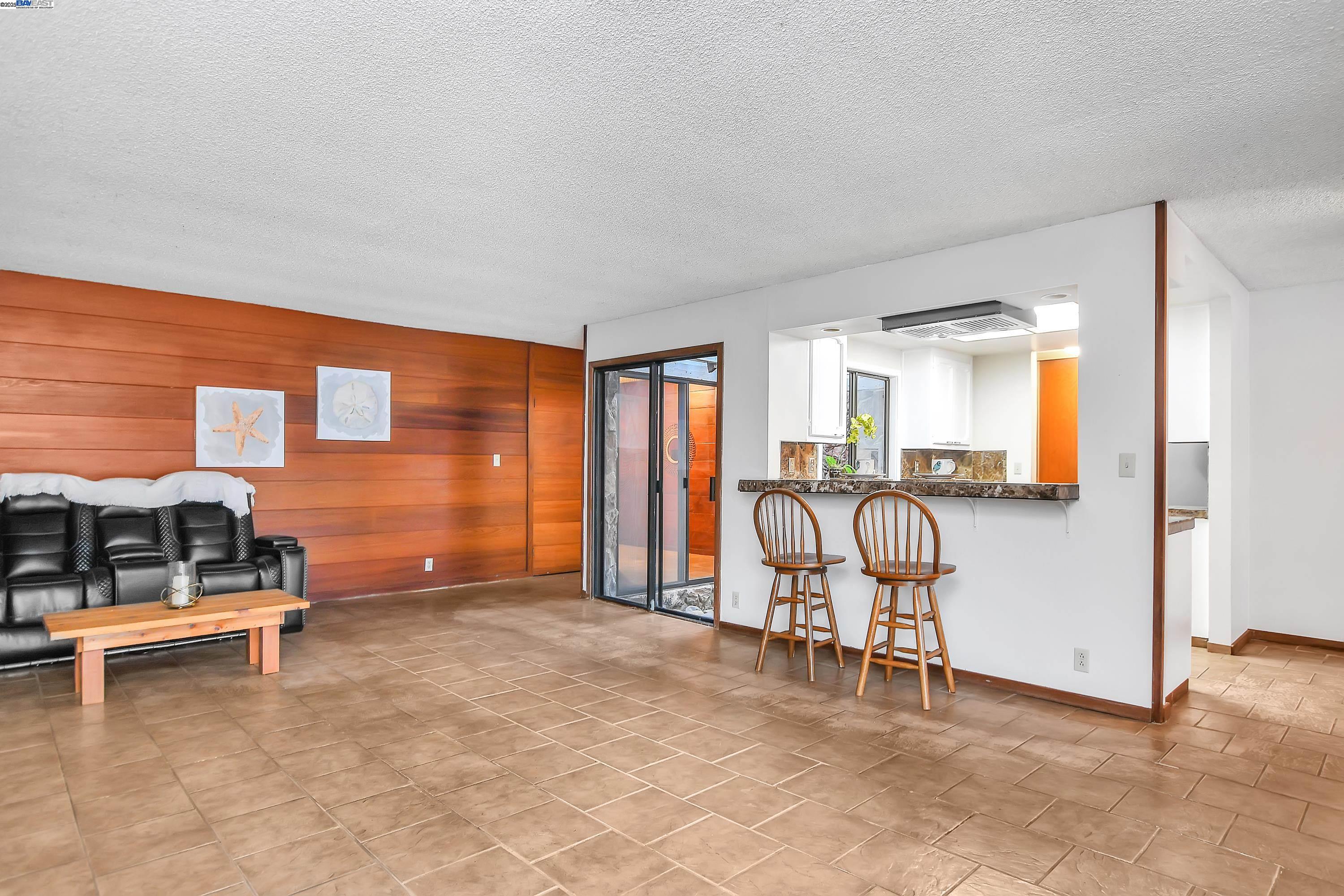 1402 Willow Lake Road Discovery Bay, CA 94505 - Photo 9 of 33 a living room with furniture a ceiling fan and a window