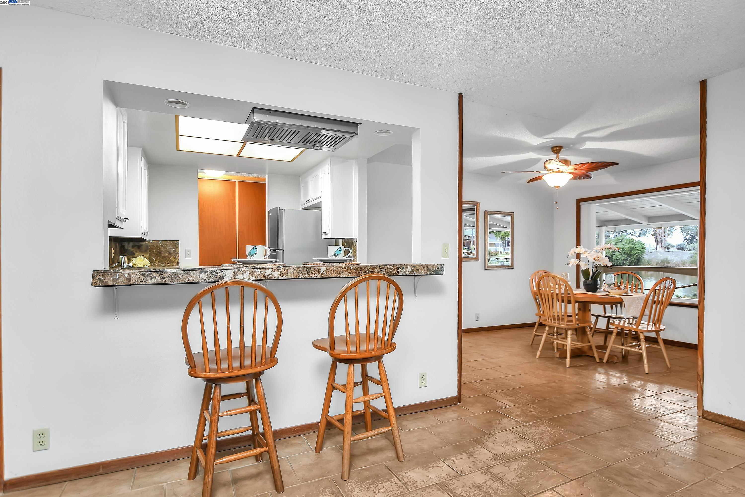 1402 Willow Lake Road Discovery Bay, CA 94505 - Photo 10 of 33 a view of a dining room with furniture window and wooden floor