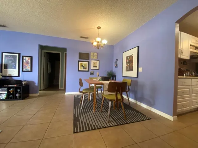 a view of a livingroom with furniture and windows