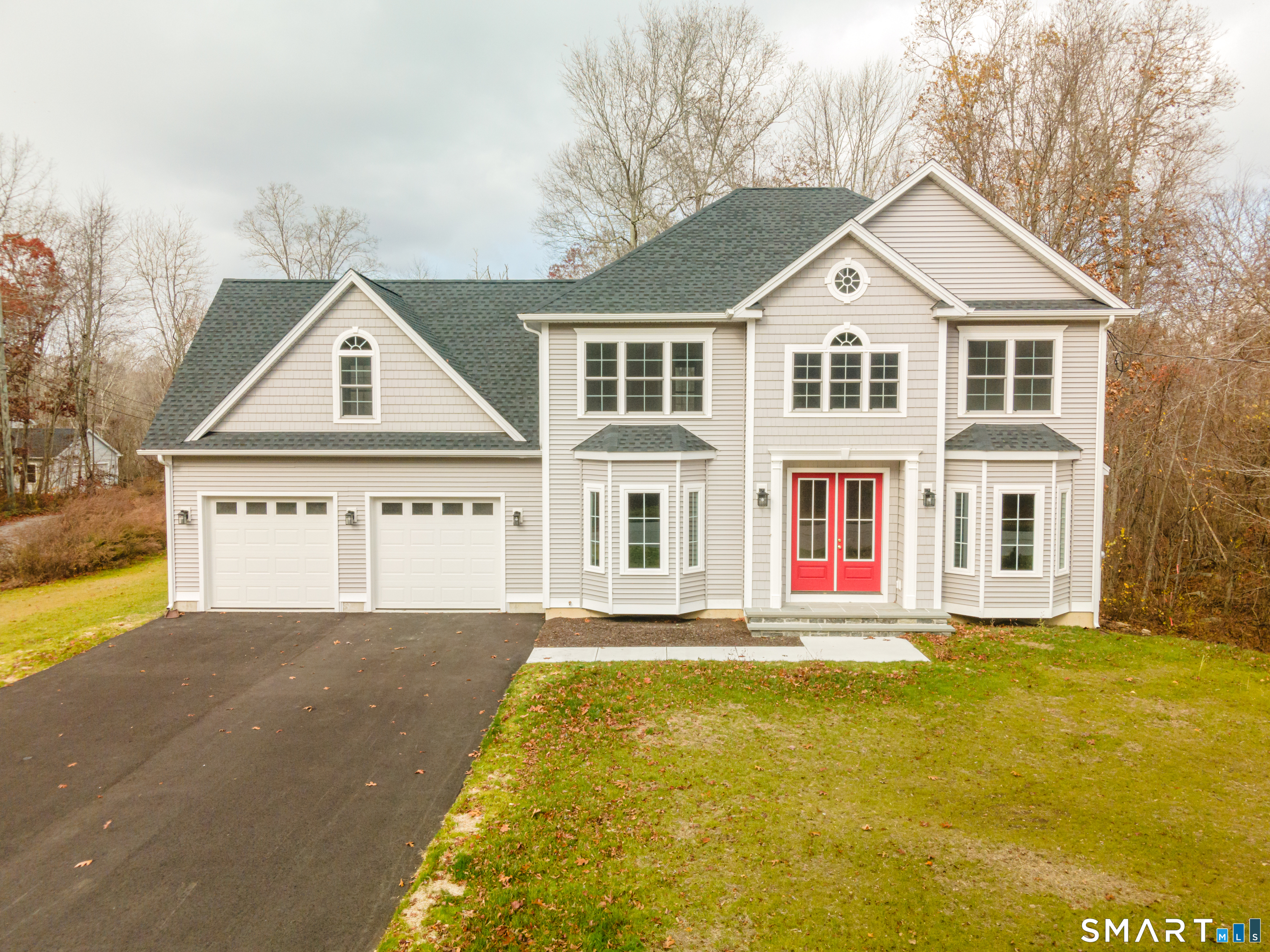 a front view of a house with a yard