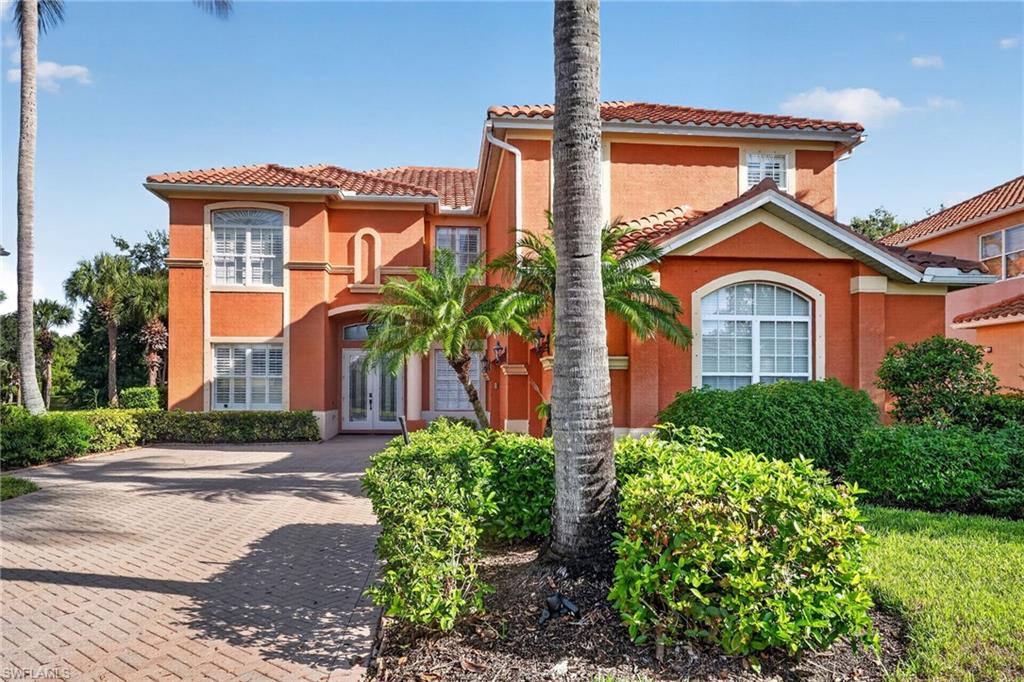 9970 Rookery Circle Estero, FL 33928 - Photo 2 of 50 Mediterranean-style architecture with an orange stucco exterior and terracotta roof tiles