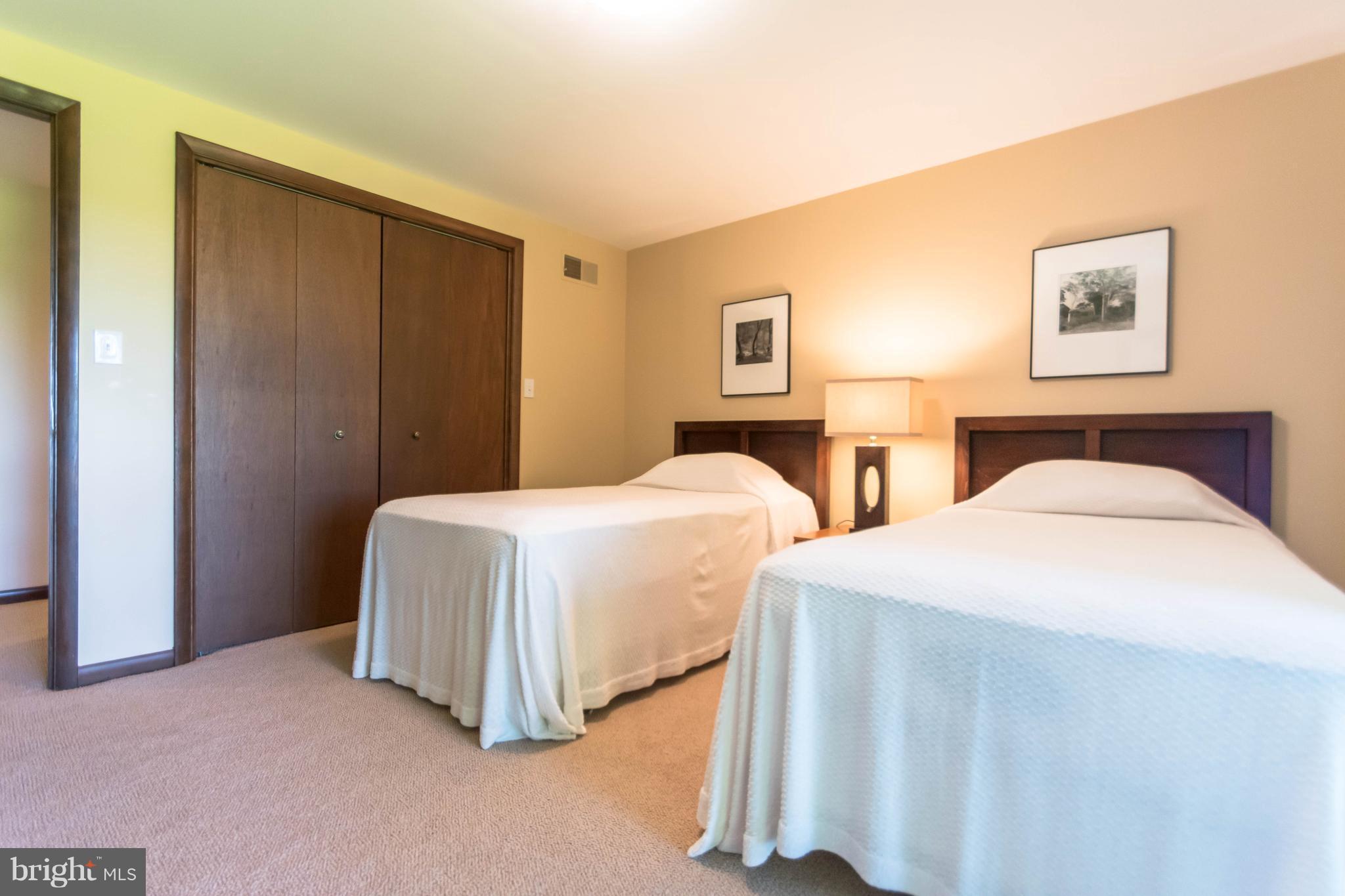 16520 York Road Monkton, MD 21111 - Photo 17 of 30 a spacious bedroom with two beds and painting on the wall