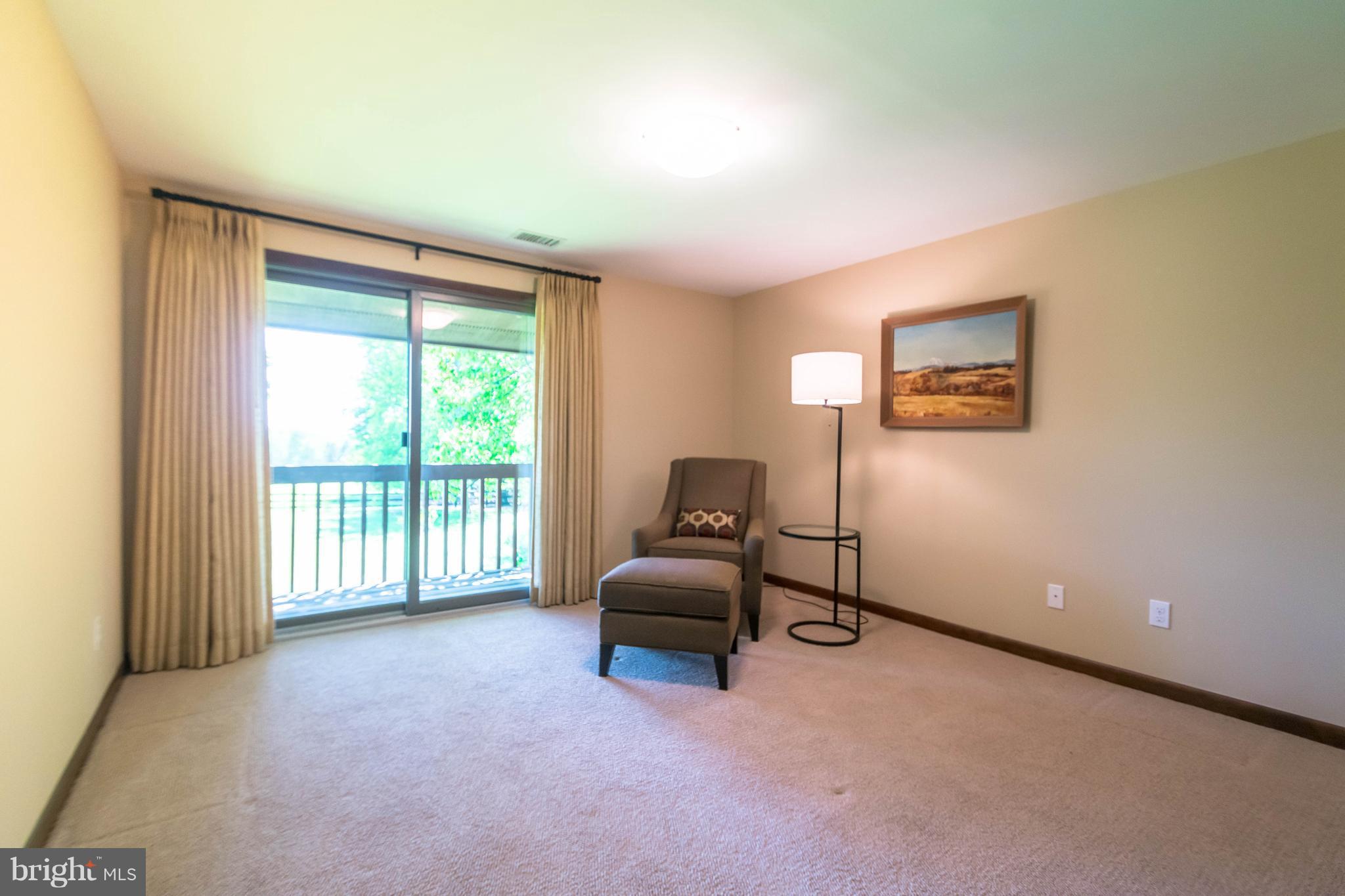 16520 York Road Monkton, MD 21111 - Photo 18 of 30 a living room with furniture and a floor to ceiling window