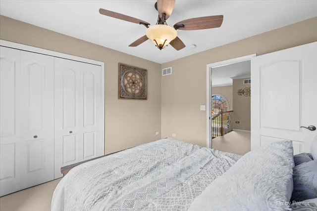 a bedroom with a bed dresser and a window