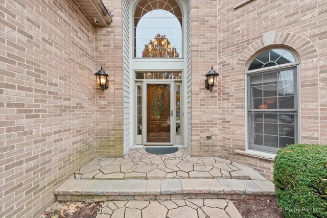 a view of entryway livingroom and hall with wooden floor