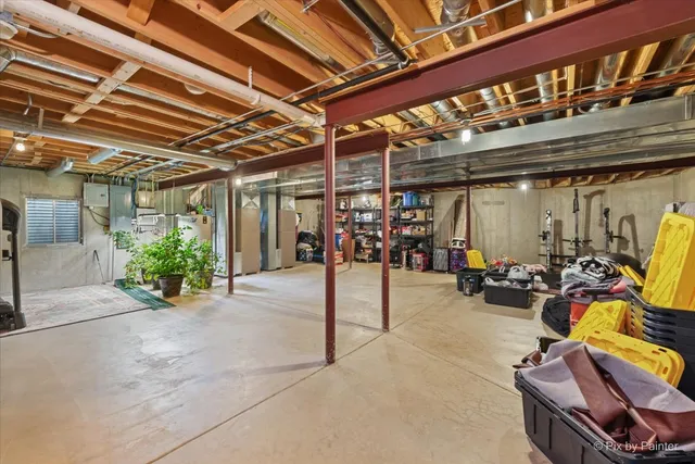 a view of a patio with table and chairs and potted plants