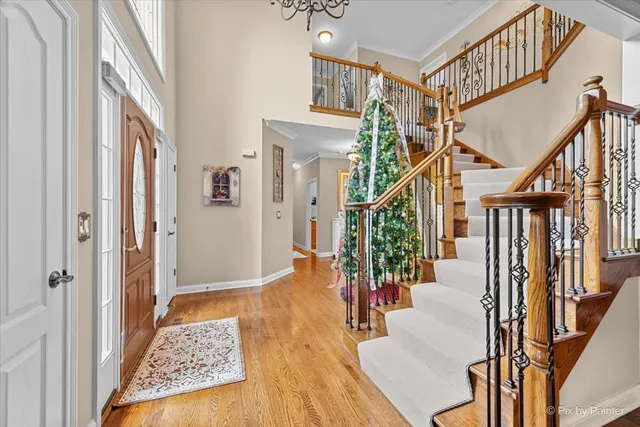a large kitchen with kitchen island a stove a sink a center island and living room view
