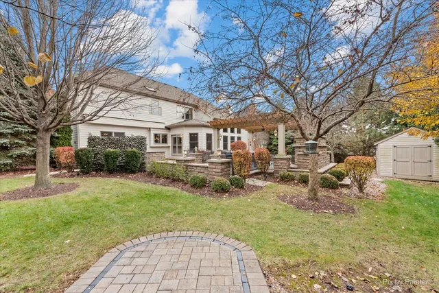 a view of a house with backyard porch and sitting area