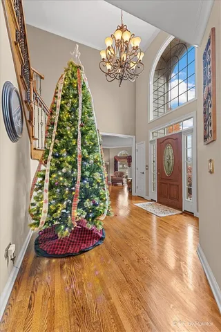 a kitchen with stainless steel appliances kitchen island granite countertop a table chairs and a sink