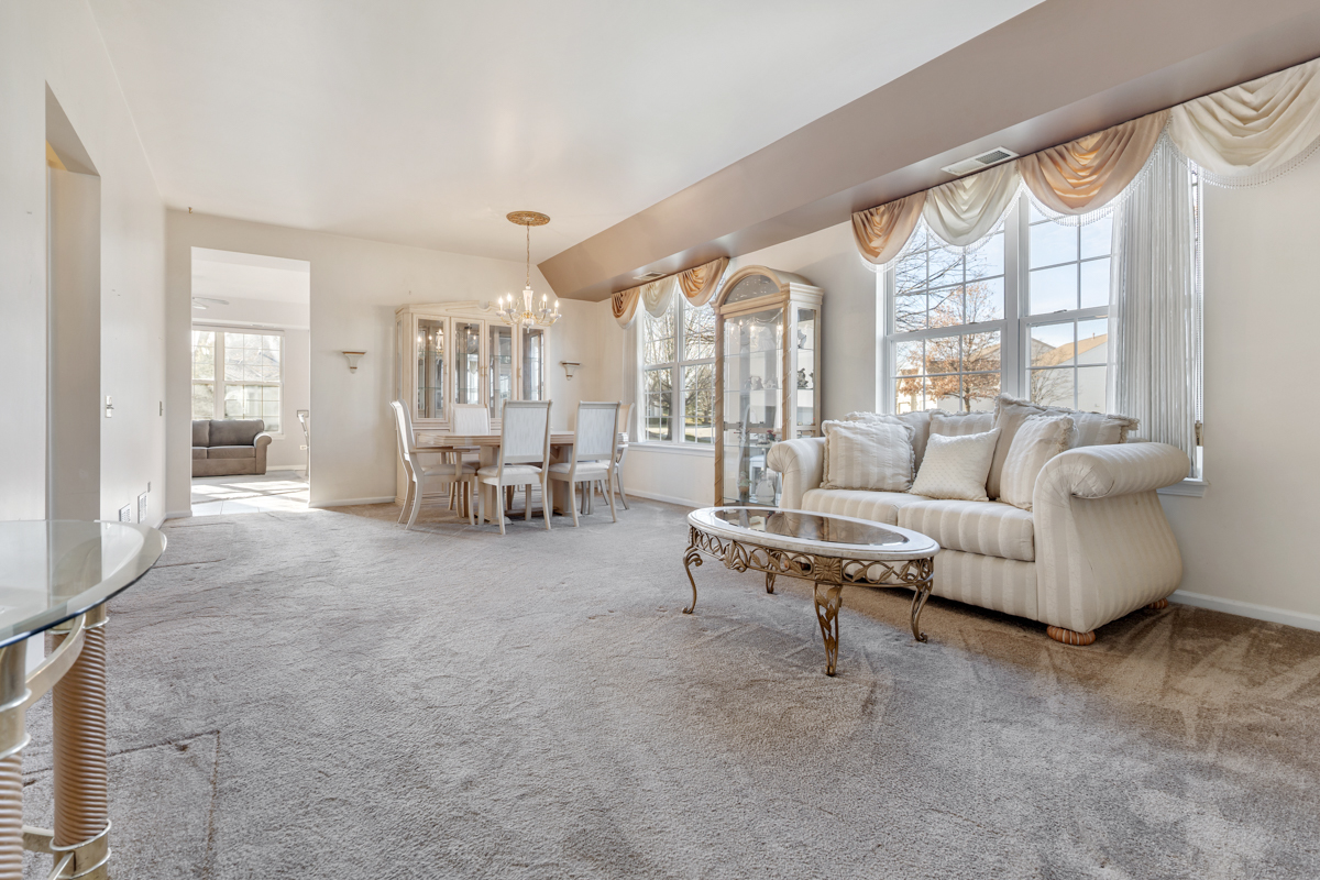 13567 Morgan Way Huntley, IL 60142 - Photo 13 of 26 a living room with furniture and a large window