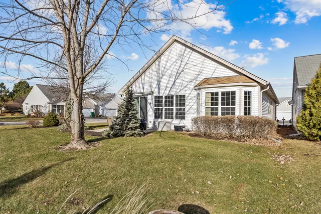a view of house with yard