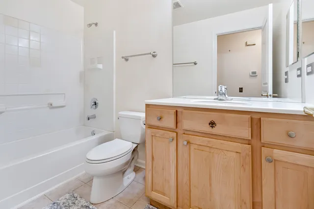 a bathroom with a sink a toilet and a bathtub