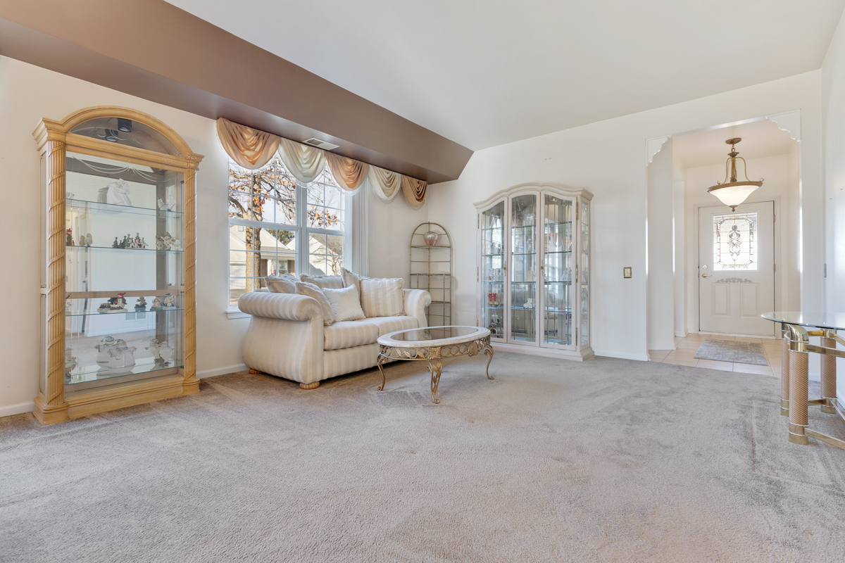 13567 Morgan Way Huntley, IL 60142 - Photo 3 of 26 a living room with furniture and a large window
