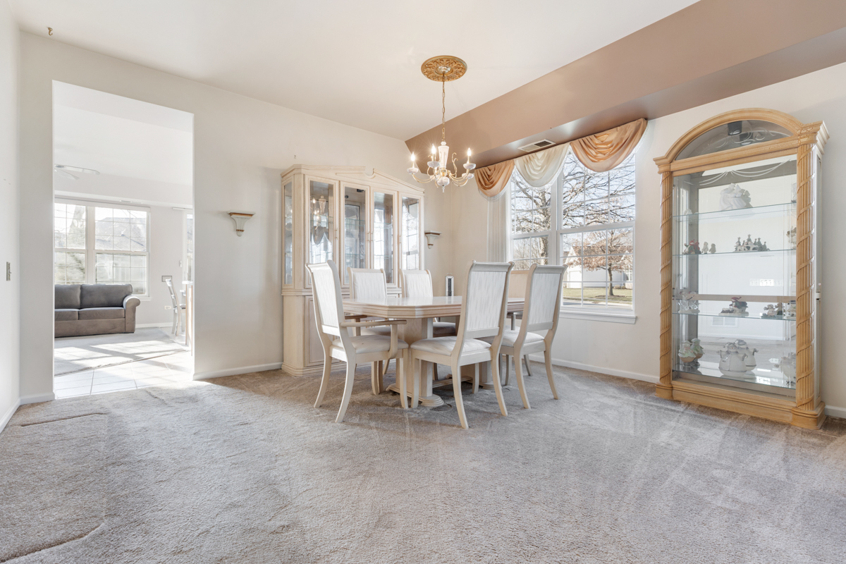 13567 Morgan Way Huntley, IL 60142 - Photo 8 of 26 a view of a dining room with furniture window and outside view