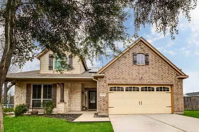a view of a house with a yard and plants