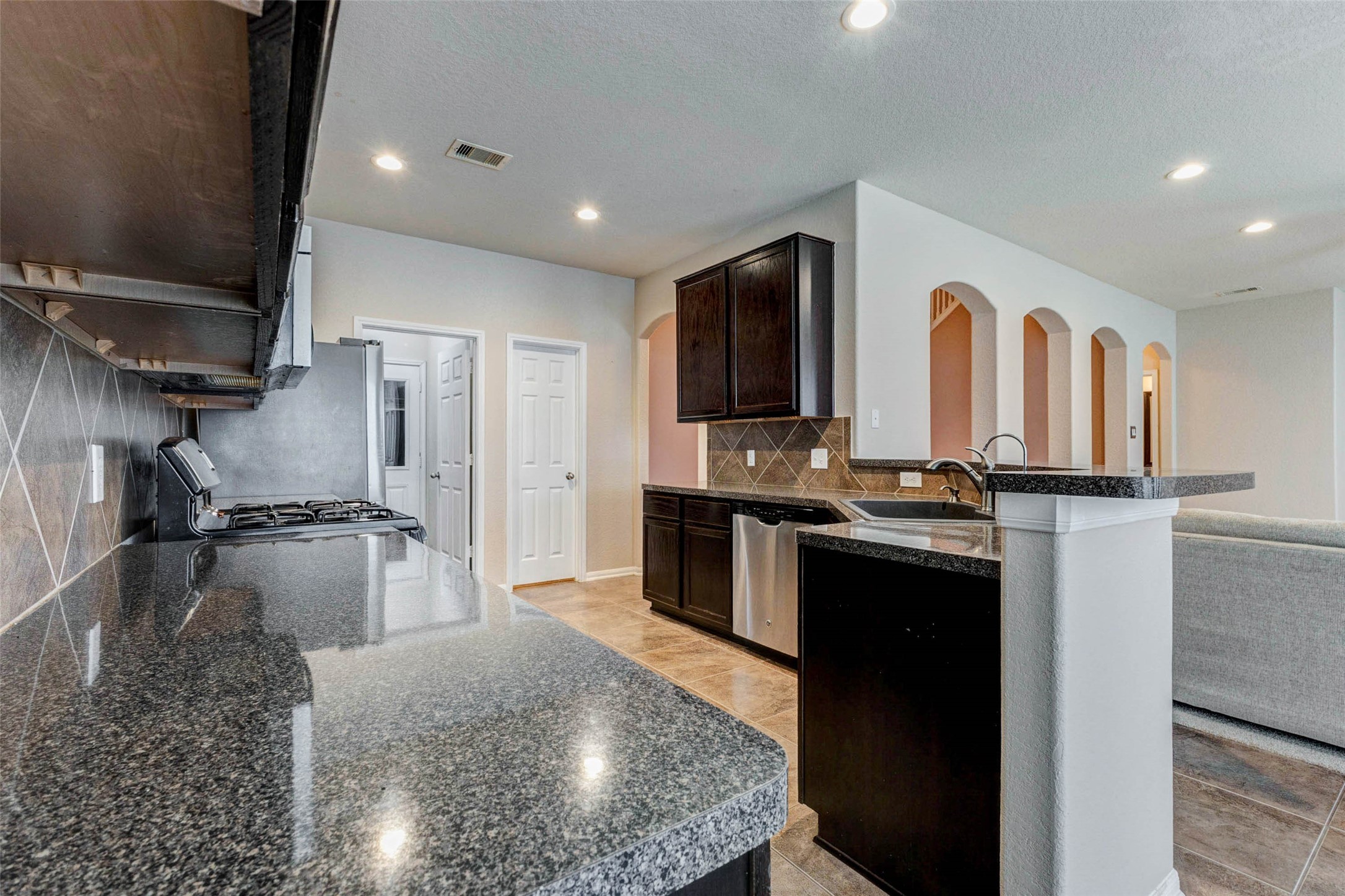 7638 Alum Lane Baytown, TX 77521 - Photo 14 of 44 a kitchen with refrigerator and cabinets