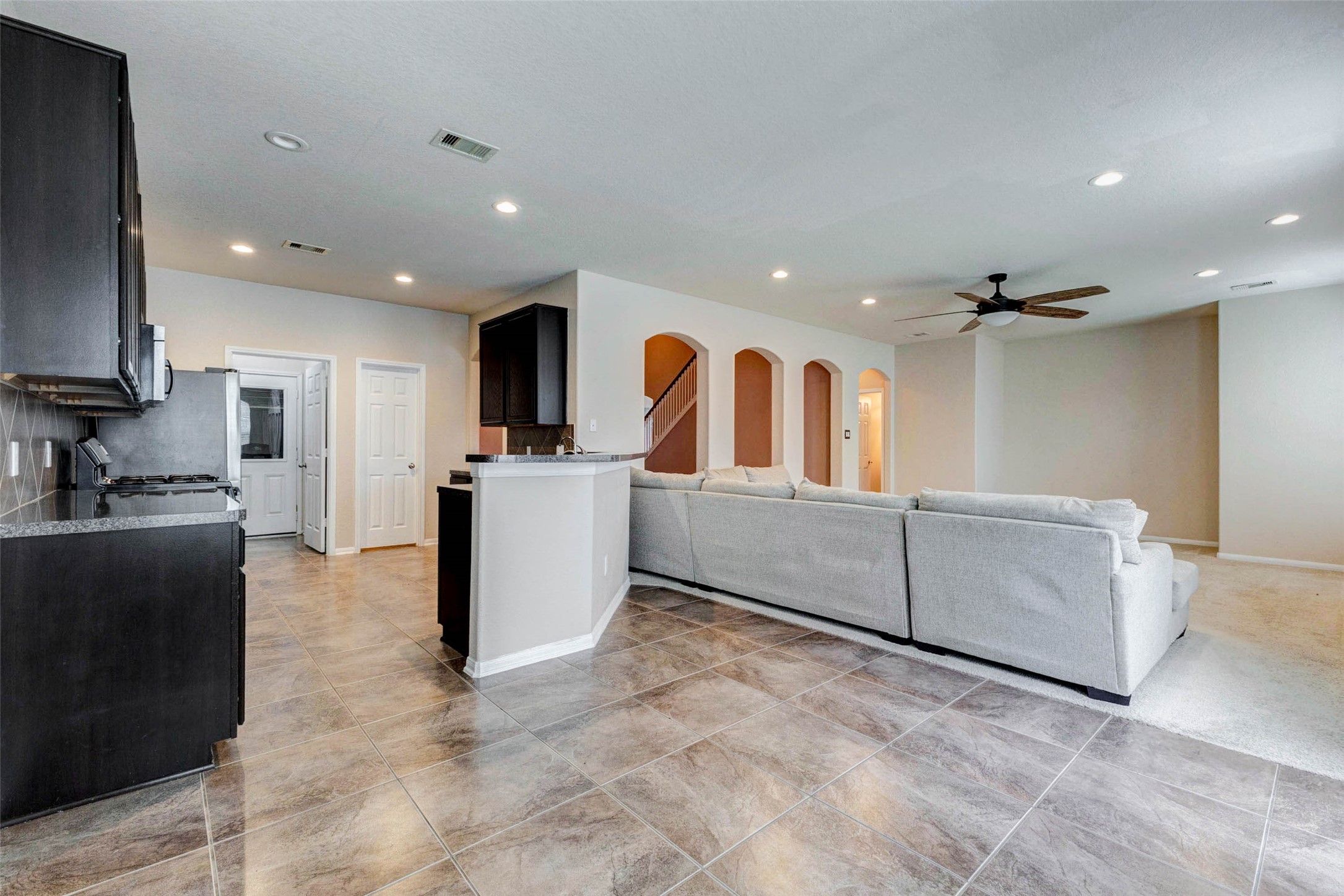 7638 Alum Lane Baytown, TX 77521 - Photo 16 of 44 a living room with furniture and a flat screen tv