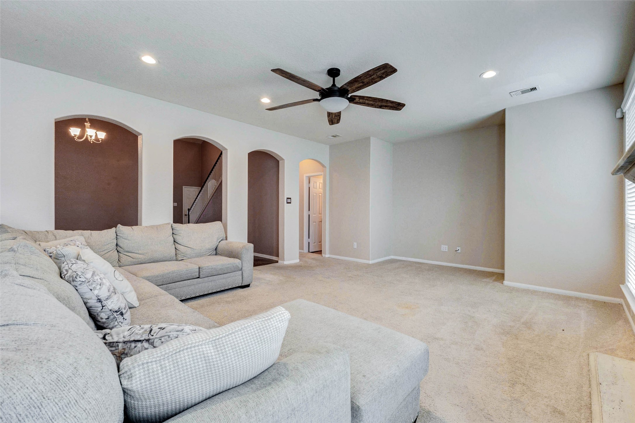 7638 Alum Lane Baytown, TX 77521 - Photo 17 of 44 a living room with furniture and a ceiling fan