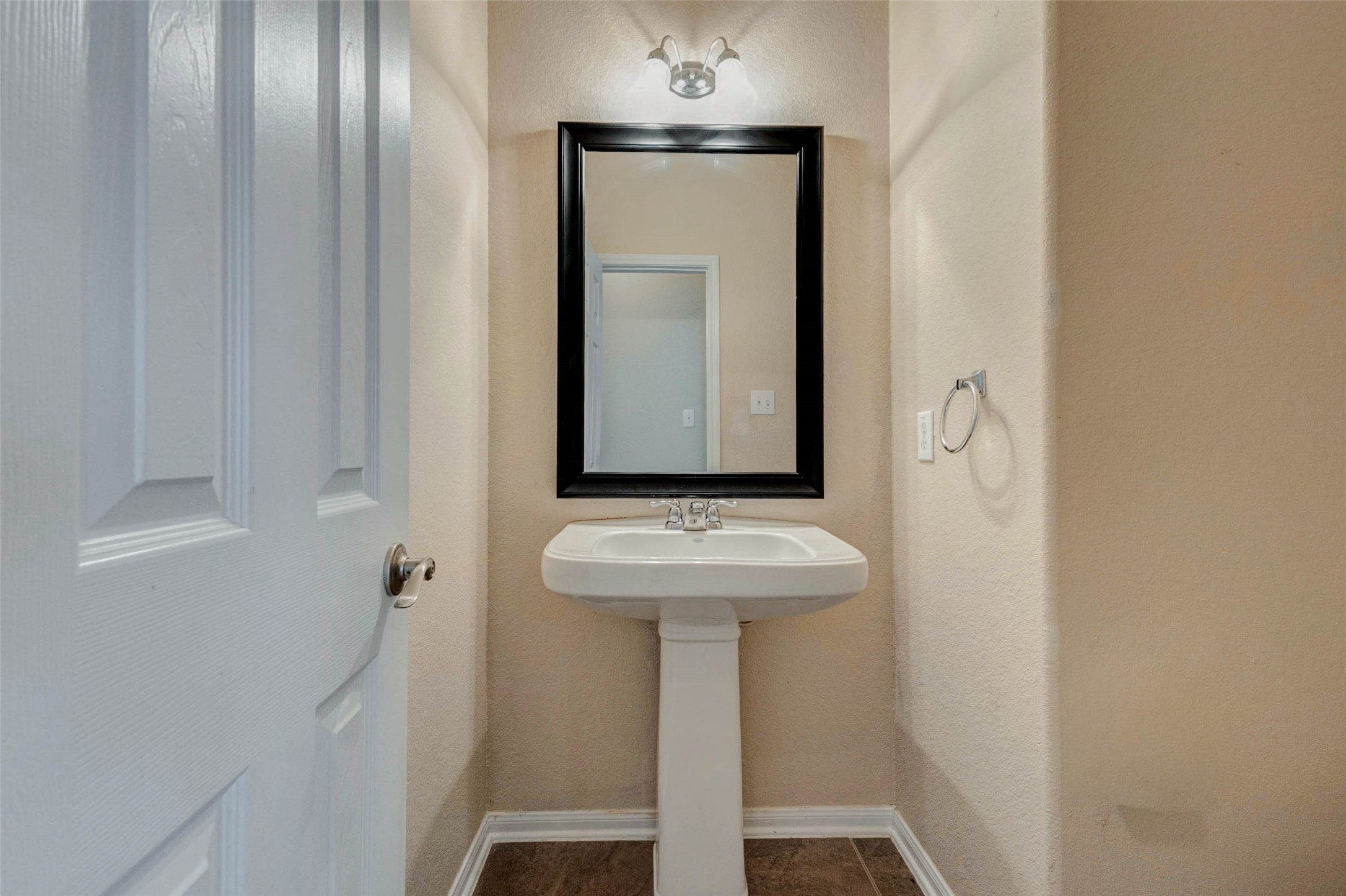 7638 Alum Lane Baytown, TX 77521 - Photo 19 of 44 a bathroom with a sink and mirror