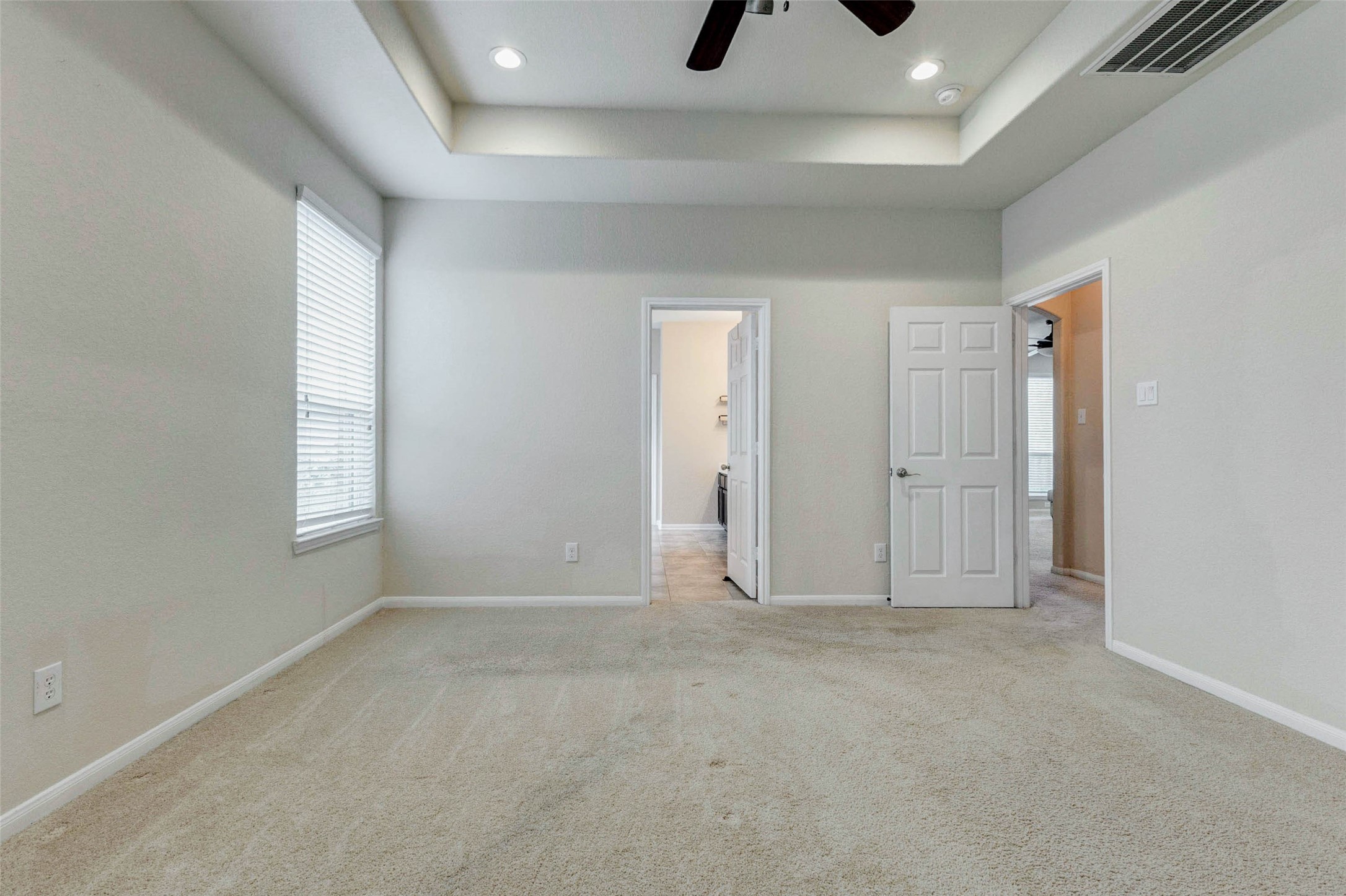 7638 Alum Lane Baytown, TX 77521 - Photo 22 of 44 an empty room with windows and cabinet