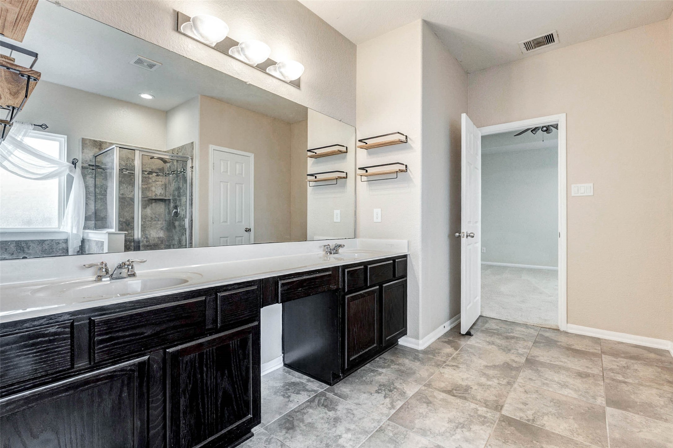 7638 Alum Lane Baytown, TX 77521 - Photo 24 of 44 a kitchen with a sink and a refrigerator