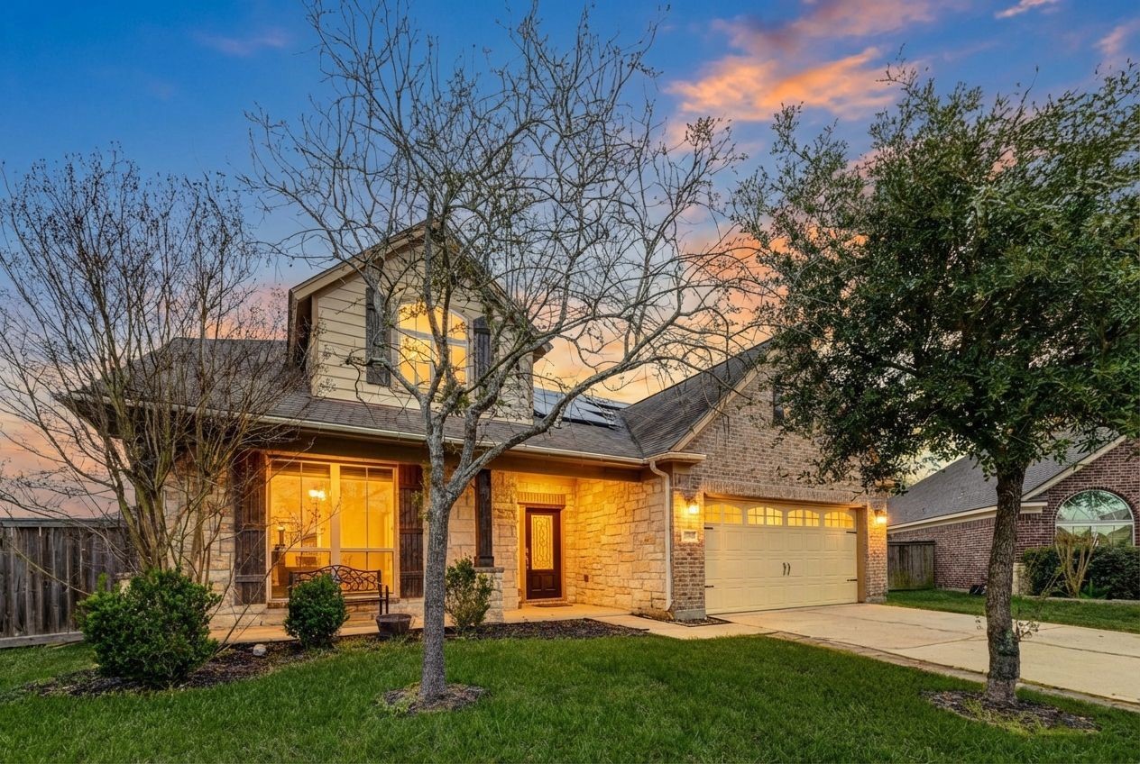 7638 Alum Lane Baytown, TX 77521 - Photo 3 of 44 a front view of a house with a yard and a tree
