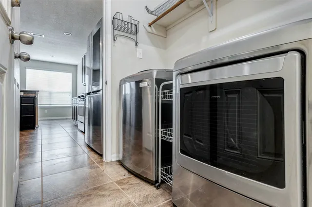 a view of a hallway with wooden cabinets