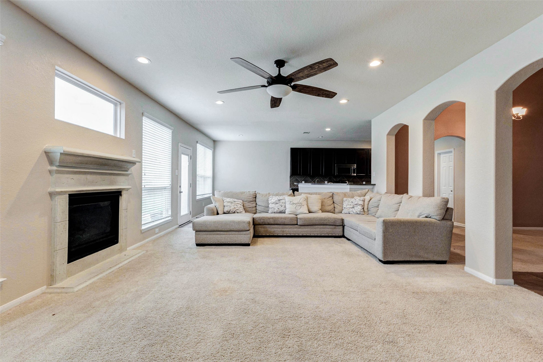7638 Alum Lane Baytown, TX 77521 - Photo 5 of 44 a living room with furniture and a fireplace