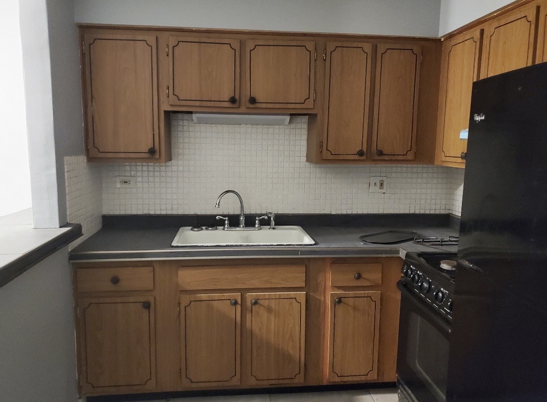 550 Michigan City Road, Unit 1C Calumet City, IL 60409 - Photo 3 of 6 a kitchen with stainless steel appliances granite countertop a sink stove and cabinets