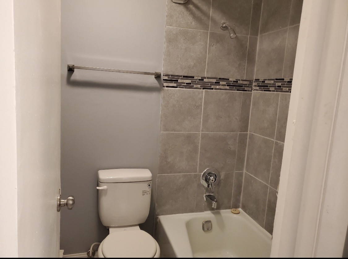 550 Michigan City Road, Unit 1C Calumet City, IL 60409 - Photo 6 of 6 a bathroom with a toilet and a shower