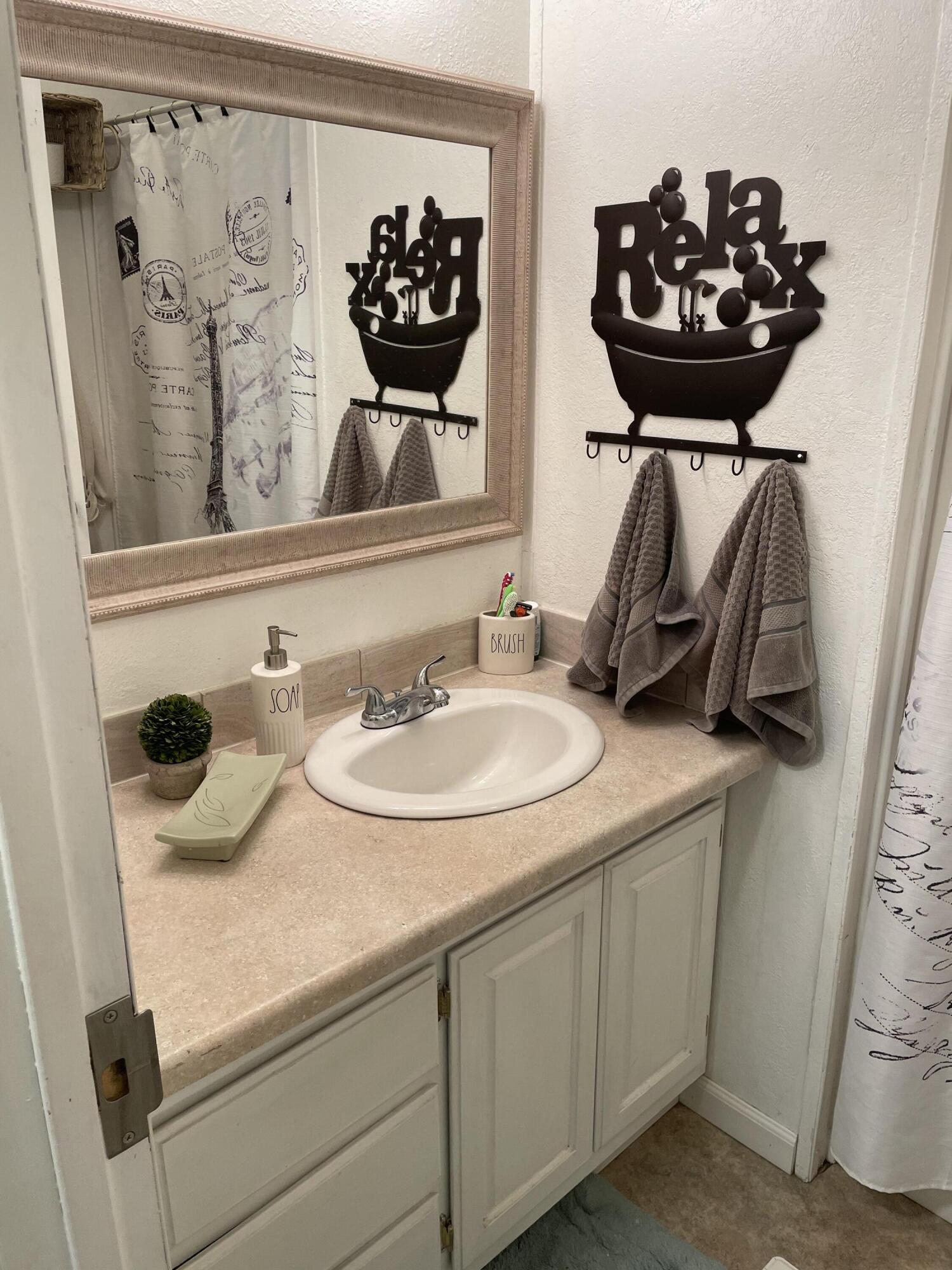 60901 Brosterhous Road, Unit 737 Bend, OR 97702 - Photo 10 of 17 a bathroom with a sink and a mirror