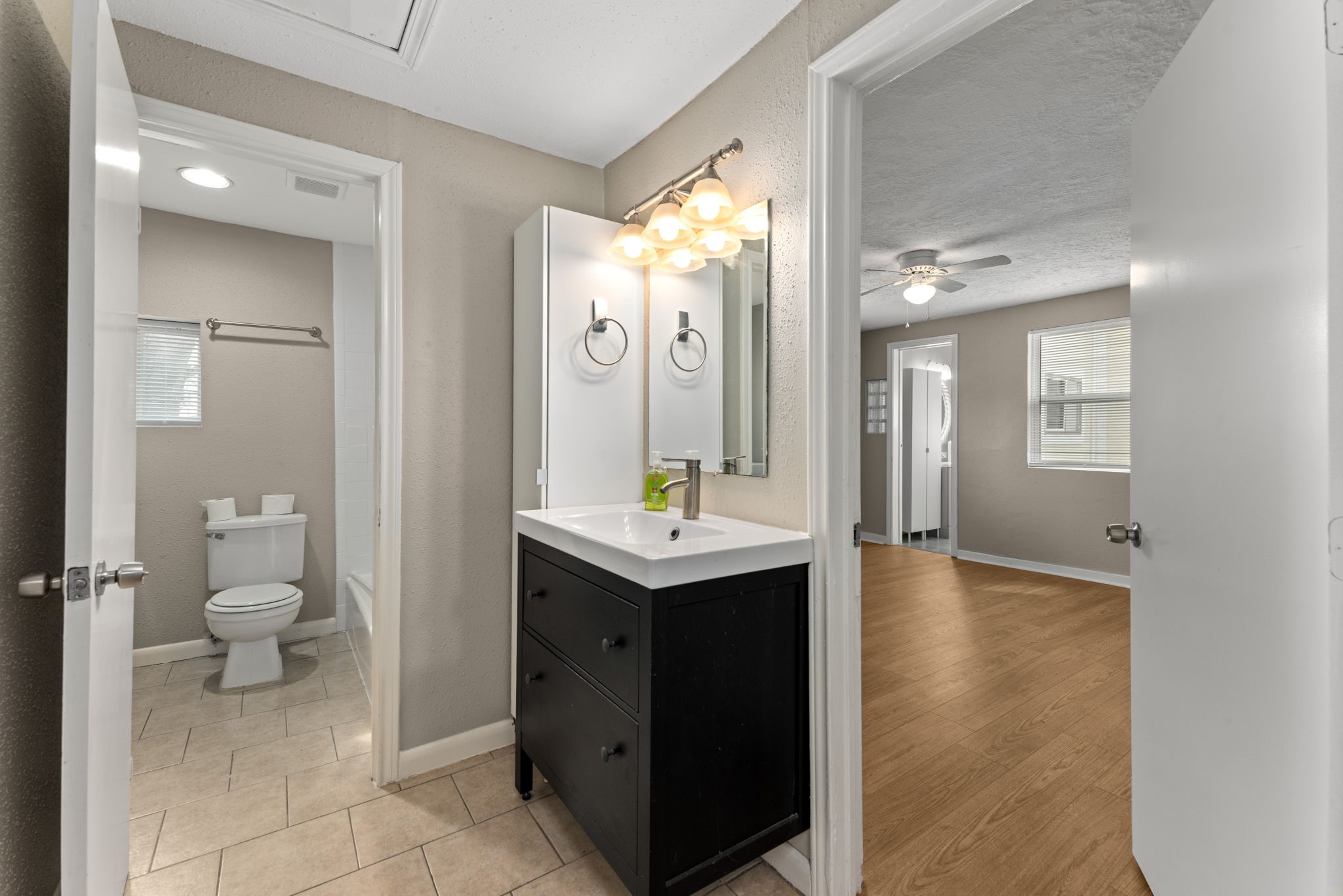 5311 Gano Street Houston, TX 77009 - Photo 20 of 35 a bathroom with a sink a toilet and a mirror