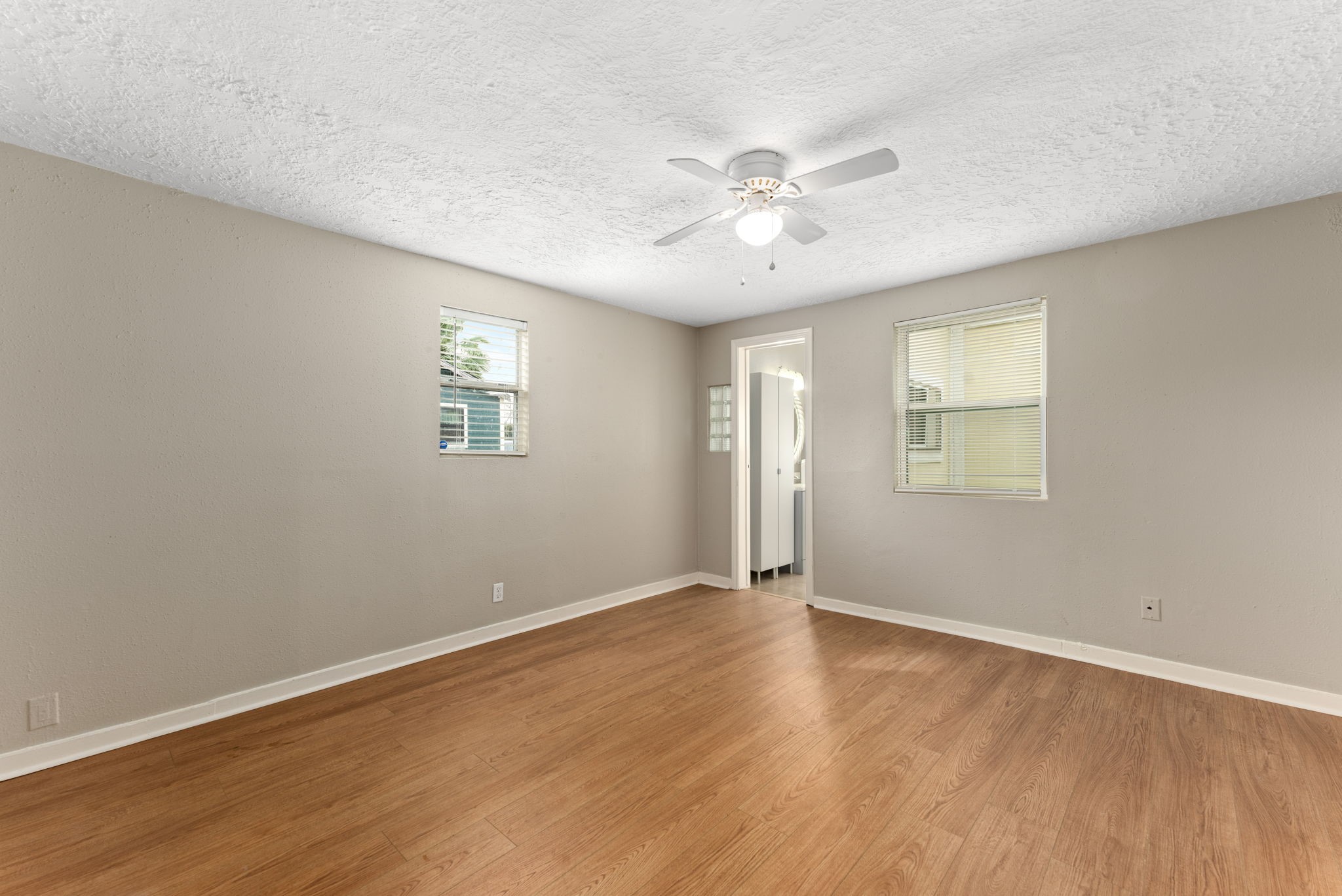 5311 Gano Street Houston, TX 77009 - Photo 21 of 35 a view of an empty room with wooden floor and a window