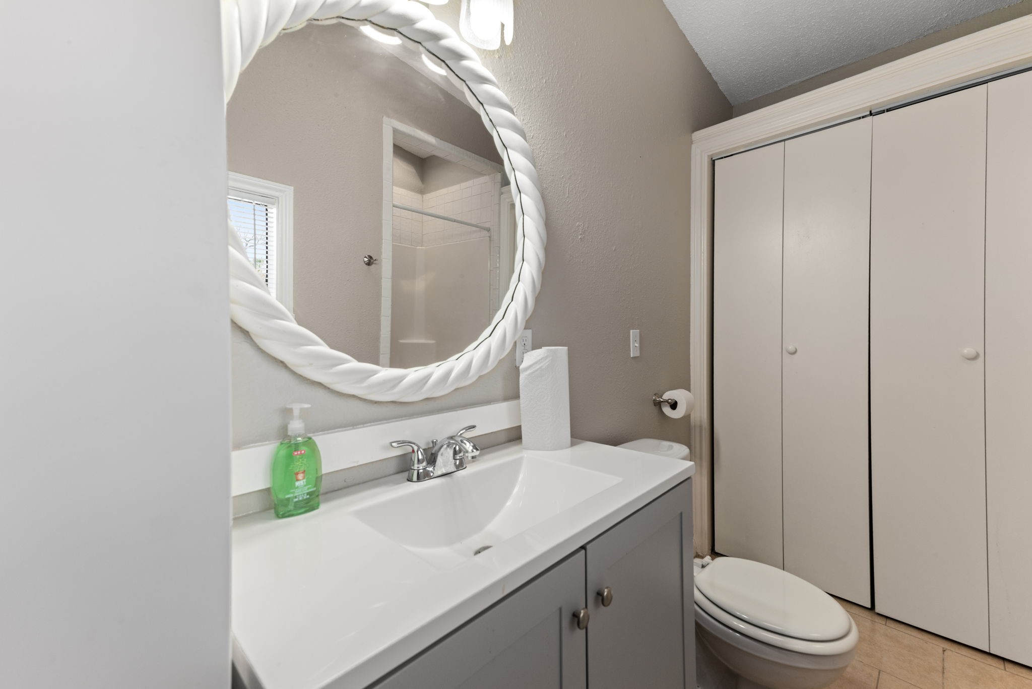 5311 Gano Street Houston, TX 77009 - Photo 25 of 35 a bathroom with a sink a toilet and a mirror