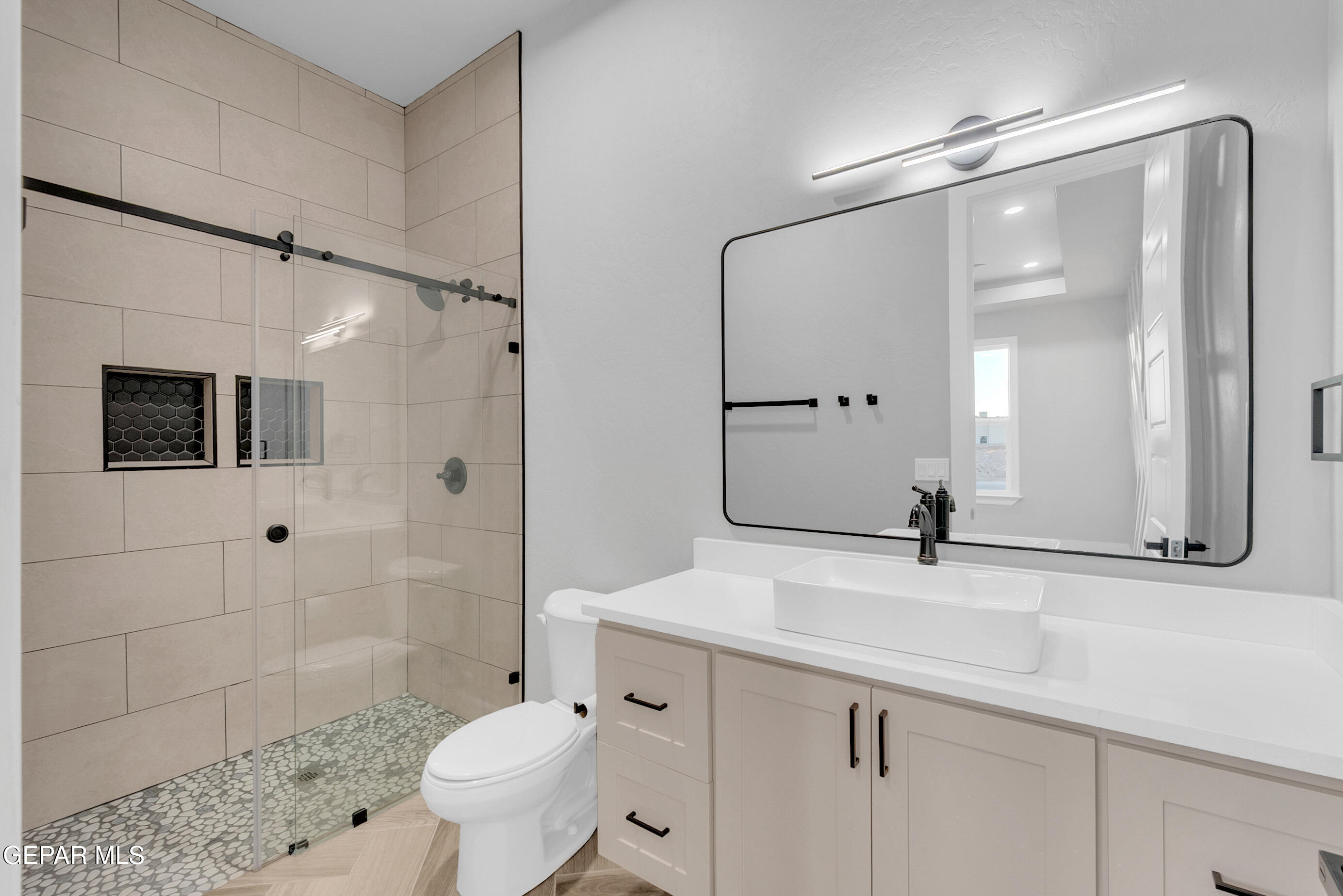 5612 Rio Bonito Circle El Paso, TX 79932 - Photo 39 of 79 a bathroom with a sink a toilet and shower